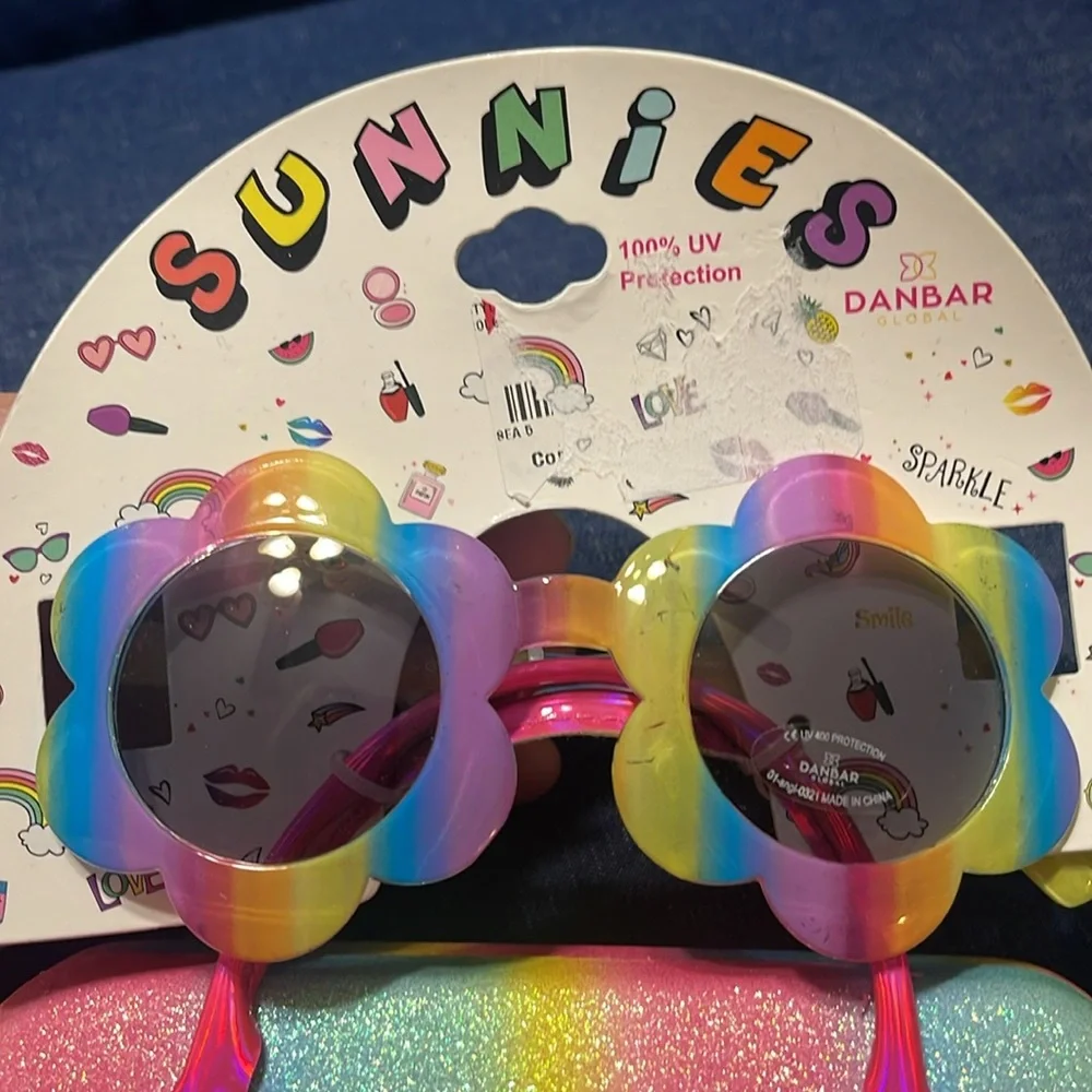 Sunglasses and case. Little girl. Few scratches on the frame. See pictures